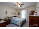 Cozy bedroom featuring a ceiling fan, carpet and neutral walls for a peaceful retreat at 407 Hertling Nw Dr, Concord, NC 28027
