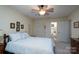 Serene bedroom featuring a private bathroom, natural light and a ceiling fan at 407 Hertling Nw Dr, Concord, NC 28027