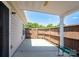 Private covered patio offers a serene outdoor space with fenced in yard at 407 Hertling Nw Dr, Concord, NC 28027