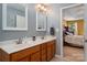 Bathroom featuring a double vanity with cherry cabinets and tile flooring at 512 Veloce Trl, Fort Mill, SC 29715