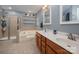 Bright bathroom with double vanity, soaking tub, and glass enclosed shower at 512 Veloce Trl, Fort Mill, SC 29715