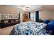 Comfortable bedroom featuring a sitting area, ceiling fan, and bright natural light at 512 Veloce Trl, Fort Mill, SC 29715