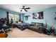 Spacious bedroom with blue accent wall and fan at 512 Veloce Trl, Fort Mill, SC 29715