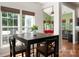 Cozy breakfast nook with a dark wood table, views of backyard and natural light from two large windows at 512 Veloce Trl, Fort Mill, SC 29715