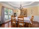 Elegant dining room with a chandelier, beautiful hutch, and seating for six at 512 Veloce Trl, Fort Mill, SC 29715