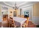 Open dining room with views to the kitchen and office area at 512 Veloce Trl, Fort Mill, SC 29715