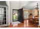 Welcoming entryway with hardwood floors leading to a dining area and office space at 512 Veloce Trl, Fort Mill, SC 29715