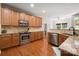 Modern kitchen with stainless steel appliances and granite countertops at 512 Veloce Trl, Fort Mill, SC 29715