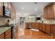 Spacious kitchen features granite counters, stainless appliances, hardwood floors, and a breakfast nook at 512 Veloce Trl, Fort Mill, SC 29715