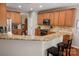 Kitchen featuring granite countertops, stainless steel appliances, and a breakfast bar with seating at 512 Veloce Trl, Fort Mill, SC 29715