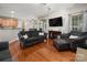 Bright living room with hardwood floors, neutral paint, and a comfortable seating area at 512 Veloce Trl, Fort Mill, SC 29715