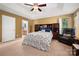 Large main bedroom with tray ceiling, carpet, and comfortable seating area at 512 Veloce Trl, Fort Mill, SC 29715