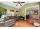Spacious sunroom with lots of windows, hardwood floors, and access to other rooms in the home at 512 Veloce Trl, Fort Mill, SC 29715