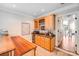 Stylish bar area with custom cabinets, a wine rack, and a built-in sink at 600 Beauhaven Ln, Waxhaw, NC 28173