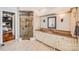 Elegant bathroom featuring a glass shower, granite countertop, and a view into an adjoining bedroom at 600 Beauhaven Ln, Waxhaw, NC 28173