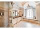 Elegant bathroom with a glass shower, soaking tub, and custom vanity at 600 Beauhaven Ln, Waxhaw, NC 28173