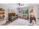 Charming Bedroom with a crib, sofa, and ample natural light from the window at 600 Beauhaven Ln, Waxhaw, NC 28173