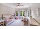 Cozy Bedroom featuring a crib, chair, and soft pink accents, creating a soothing environment at 600 Beauhaven Ln, Waxhaw, NC 28173