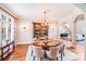 This dining room offers a built-in hutch, large window, chandelier, and seating for eight at 600 Beauhaven Ln, Waxhaw, NC 28173