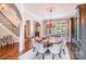 An elegant dining room features a large table for eight and a beautiful chandelier, perfect for hosting gatherings at 600 Beauhaven Ln, Waxhaw, NC 28173