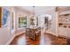Cozy dining nook with hardwood floors, a decorative wood table, and lots of natural light at 600 Beauhaven Ln, Waxhaw, NC 28173