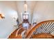Grand foyer boasts a stunning staircase, hardwood floors, and a decorative chandelier, creating a welcoming entrance at 600 Beauhaven Ln, Waxhaw, NC 28173