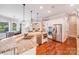 Open-concept kitchen featuring granite countertops, stainless steel appliances, and hardwood floors at 600 Beauhaven Ln, Waxhaw, NC 28173