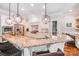 Well-lit kitchen showcasing a large granite island with seating, white cabinets, and stainless steel appliances at 600 Beauhaven Ln, Waxhaw, NC 28173