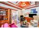 The living room has custom wood trim, a fireplace, built in bookshelves, and a comfortable sofa at 600 Beauhaven Ln, Waxhaw, NC 28173