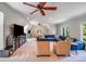 Spacious living room with a large TV, comfortable seating, and plenty of natural light at 600 Beauhaven Ln, Waxhaw, NC 28173