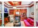 The living room has custom wood trim, a fireplace, built in bookshelves, and a comfortable sofa at 600 Beauhaven Ln, Waxhaw, NC 28173