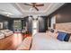 Well-lit main bedroom with dark walls and access to a private balcony at 600 Beauhaven Ln, Waxhaw, NC 28173