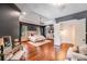 Spacious main bedroom boasts dark walls, hardwood floors, and a luxurious ensuite at 600 Beauhaven Ln, Waxhaw, NC 28173