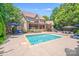 A luxury brick home showcases its beautiful pool and lounge area, perfect for outdoor relaxation and entertainment at 600 Beauhaven Ln, Waxhaw, NC 28173