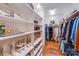 Large walk-in closet with custom shelving, closet rods, and ample storage space at 600 Beauhaven Ln, Waxhaw, NC 28173