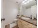 Cozy bathroom with wooden floors, cabinets and a white toilet at 6418 Tivoli Ct, Charlotte, NC 28211