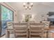 Bright dining area featuring wood table with seating and sliding glass doors for natural light at 6418 Tivoli Ct, Charlotte, NC 28211