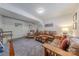 Cozy living room with modern furniture, carpeted floor and recessed lighting at 6418 Tivoli Ct, Charlotte, NC 28211