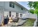 Wide shot of a backyard featuring a grill, deck, and green foliage at 713 Torrey Pines Ln, Fort Mill, SC 29715