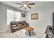 Relaxing bedroom with comfy seating and a large ceiling fan at 713 Torrey Pines Ln, Fort Mill, SC 29715