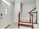 Bright foyer with hardwood floors, staircase with wooden banister, and a coat closet at 713 Torrey Pines Ln, Fort Mill, SC 29715