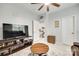 Inviting living room with wood accents, neutral walls, and a ceiling fan at 713 Torrey Pines Ln, Fort Mill, SC 29715