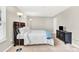 Calm bedroom with a plush bed, soft lighting, and neutral wall paint at 7339 Dover Mill Sw Dr, Concord, NC 28025