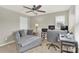 Well-lit office space equipped with a desk, comfortable seating, and modern amenities at 7339 Dover Mill Sw Dr, Concord, NC 28025