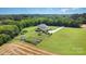 Aerial view of the home with a fenced backyard, trampoline, storage shed, and beautiful landscape at 7805 Crooked Creek Church Rd, Monroe, NC 28110