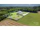 This aerial shot showcases the home's large yard, landscaping, and privacy at 7805 Crooked Creek Church Rd, Monroe, NC 28110