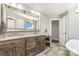 Bathroom features a dual vanity, large mirror and a separate makeup vanity area at 7805 Crooked Creek Church Rd, Monroe, NC 28110