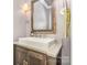 Elegant powder room with vessel sink, vanity, and stylish framed mirror at 7805 Crooked Creek Church Rd, Monroe, NC 28110