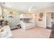 Lovely decorated bedroom with built in bunk beds, ceiling fan and colorful wallpaper at 7805 Crooked Creek Church Rd, Monroe, NC 28110