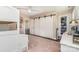 Nicely decorated bedroom with ceiling fan, barn doors, built in shelving and large closet at 7805 Crooked Creek Church Rd, Monroe, NC 28110
